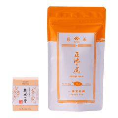 Ippodo Tea packages with orange and white design sencha bag and beige box of Ikuyo matcha with Japanese characters.
