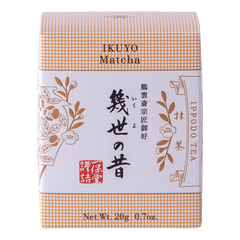 Unopened box of Ippodo Tea Co. Ikuyo matcha powder with peach color hashmarks, Japanese characters and gold flowers leaves