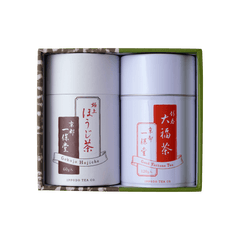 Green tea canister gift set with two white cans with white and red Japanese writing set inside green and brown decorative box