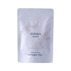 White resealable 40 gram bag of Ippodo Sayaka matcha with gold and green floral design and text