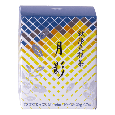 Front view of unopened tea box with blue and yellow geometric pattern, flowers and Japanese and English text