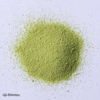 Ippodo Tea Uji-Shimizu sweetened matcha powder stone-ground green tea sprinkled on white plate