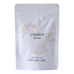 White resealable 40 gram bag of Ippodo Ummon matcha with gold and green floral design and text