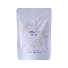 White resealable 40 gram bag of Ippodo Ummon matcha with gold and green floral design and text