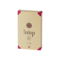 Sealed tall, cream box of 12 Ippodo Gyokuro One-Cup Teabags with pink corners and logo on bronze circle and easy open tab