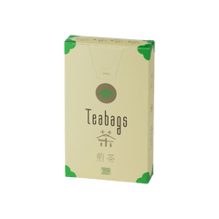Sealed tall, cream box of 12 Ippodo Sencha One-Cup Teabags with green corners and logo on bronze circle and easy open tab