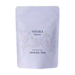White resealable 100 gram bag of Ippodo Sayaka matcha with gold minimalist floral design