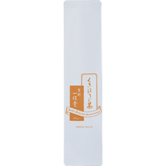 White and orange iconic packaging for Ippodo Tea Co. Stems Hojicha roasted green tea with Japanese writing and dashed lines