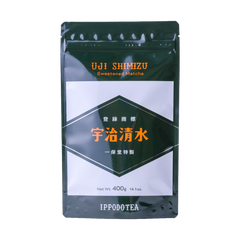 Grey and black large bag of Ippodo's Uji-Shimizu sweetened matcha tea powder with red font Japanese characters