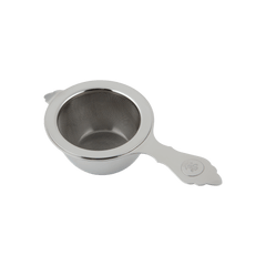 Stainless steel Chakoshi tea strainer with Ippodo Tea logo seal embossed on handle nestled in protective receiving bowl