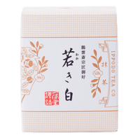 Brand new unopened box of Ippodo Tea Co. Wakaki matcha with Japanese characters and gold leaf flowers embossed on white