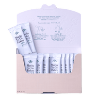Peach color box with front flap open revealing ten individual white plastic Ippodo Matcha-To-Go Packets with easy open tops