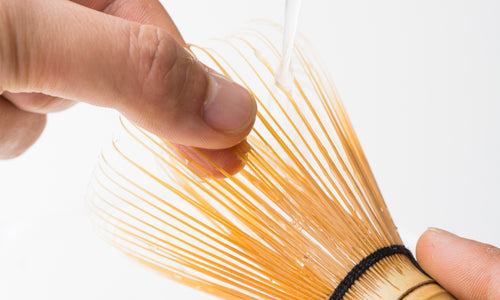 Holding and straightening tips of Korean artisan-made Chasen 80-tip bamboo matcha tea whisk utensil