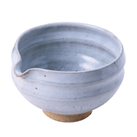 Artisan-made ceramic speckled white matcha tea bowl with hand groove and serving spout made from Mino-yaki Japanese clay