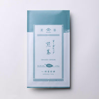 White and pale blue grey traditional packaging bag with Japanese characters for Ippodo Tea Co. Rimpo Organic Sencha green tea