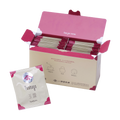 Open box filled with Ippodo gyokuro tea bag packets with magenta accents, alongside a single gyokuro packet in front. - thumbnail 1