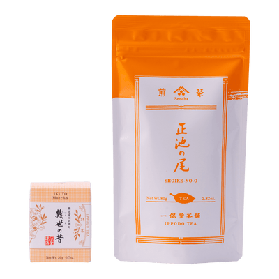 Ippodo Tea packages with orange and white design sencha bag and beige box of Ikuyo matcha with Japanese characters.