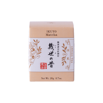 Unopened box of Ippodo Tea Co. Ikuyo matcha powder with peach color hashmarks, Japanese characters and gold flowers leaves