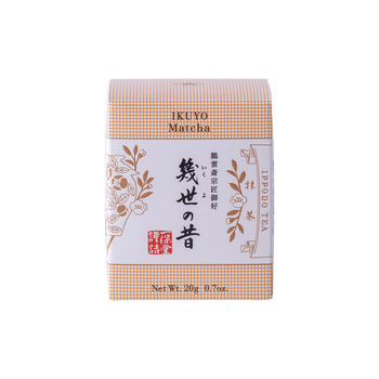 Unopened box of Ippodo Tea Co. Ikuyo matcha powder with peach color hashmarks, Japanese characters and gold flowers leaves