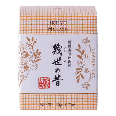 Unopened box of Ippodo Tea Co. Ikuyo matcha powder with peach color hashmarks, Japanese characters and gold flowers leaves