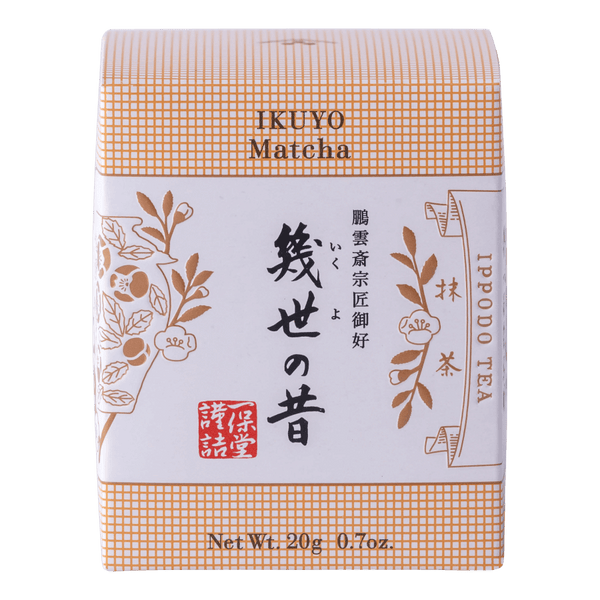 Unopened box of Ippodo Tea Co. Ikuyo matcha powder with peach color hashmarks, Japanese characters and gold flowers leaves