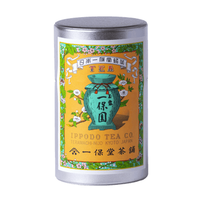 Tea canister with iconic colorful label featuring a green teapot and floral design with Japanese characters