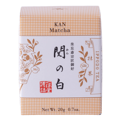 New unopened peach box of Ippodo Tea Co. Kan matcha powder with Japanese characters and gold leaf flowers embossed 