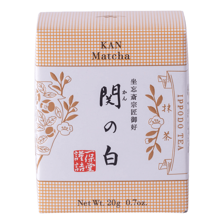 New unopened peach box of Ippodo Tea Co. Kan matcha powder with Japanese characters and gold leaf flowers embossed 