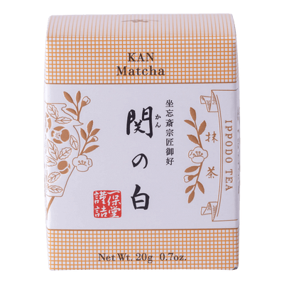 New unopened peach box of Ippodo Tea Co. Kan matcha powder with Japanese characters and gold leaf flowers embossed 