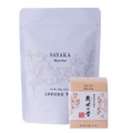 Two packages of matcha tea, one larger and one smaller, with 'SAYAKA Matcha' branding.