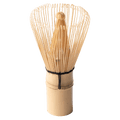 100-tip bamboo chasen matcha whisk tea utensil with curles tips resting upright on handle