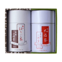 Green tea canister gift set with two white cans with white and red Japanese writing set inside green and brown decorative box