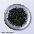Loose leaf dark green rolled dried Ippodo Gyokuro premium Japanese green tea on silver plate