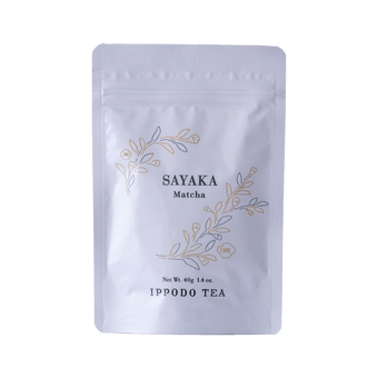 White resealable 40 gram bag of Ippodo Sayaka matcha with gold and green floral design and text