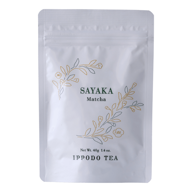 White resealable 40 gram bag of Ippodo Sayaka matcha with gold and green floral design and text