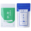Bright green and white pouch of Uji Shincha tea with white Japanese writing beside blue package of Kumpu premium sencha tea
