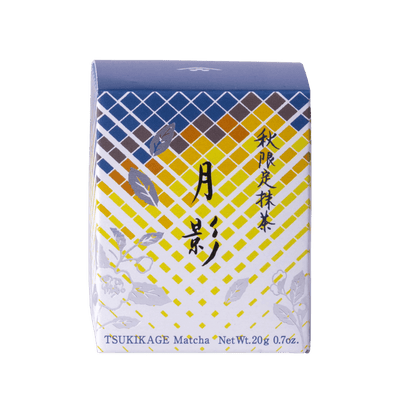 Front view of unopened tea box with blue and yellow geometric pattern, flowers and Japanese and English text