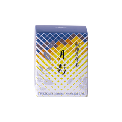 Front view of unopened tea box with blue and yellow geometric pattern, flowers and Japanese and English text