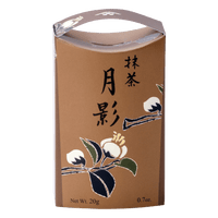 Unopened brown decorative box of Ippodo Tea Tsukikage matcha with black Japanese characters and traditional white flowers