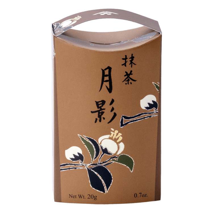 Unopened brown decorative box of Ippodo Tea Tsukikage matcha with black Japanese characters and traditional white flowers