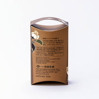 Back of decorative brown box of Tsukikage matcha with flowers illustration and black text on white background