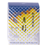 Front view of unopened tea box with blue and yellow geometric pattern, flowers and Japanese and English text