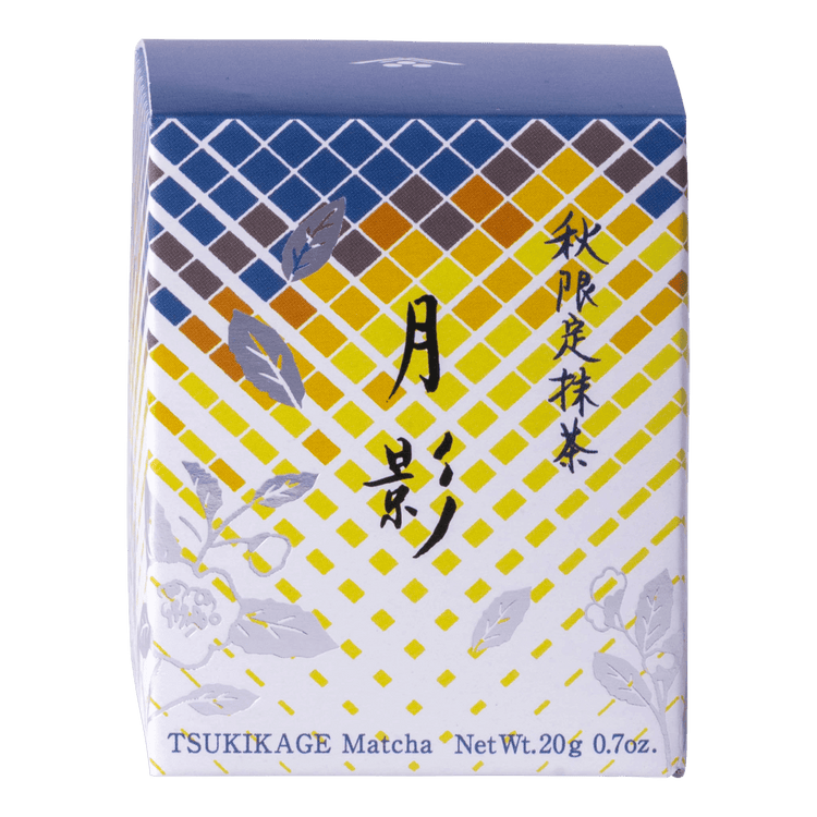 Front view of unopened tea box with blue and yellow geometric pattern, flowers and Japanese and English text