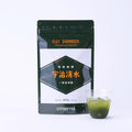 Uji Shimizu sweetened matcha package with a glass of iced matcha on a white background