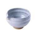 Artisan-made ceramic speckled white matcha tea bowl with hand groove and serving spout made from Mino-yaki Japanese clay