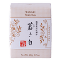 New unopened beige box of Ippodo Tea Co. Wakaki matcha with Japanese characters and gold leaf flowers embossed on white
