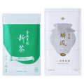 Bright green and white pouch of Uji Shincha tea white Japanese writing beside white and olive green package of Rimpo gyokuro