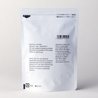Back of white 100g bag of Ippodo Sayaka matcha showing English brewing instructions, nutritional information and ingredients