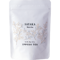 White resealable 100 gram bag of Ippodo Sayaka matcha with gold minimalist floral design