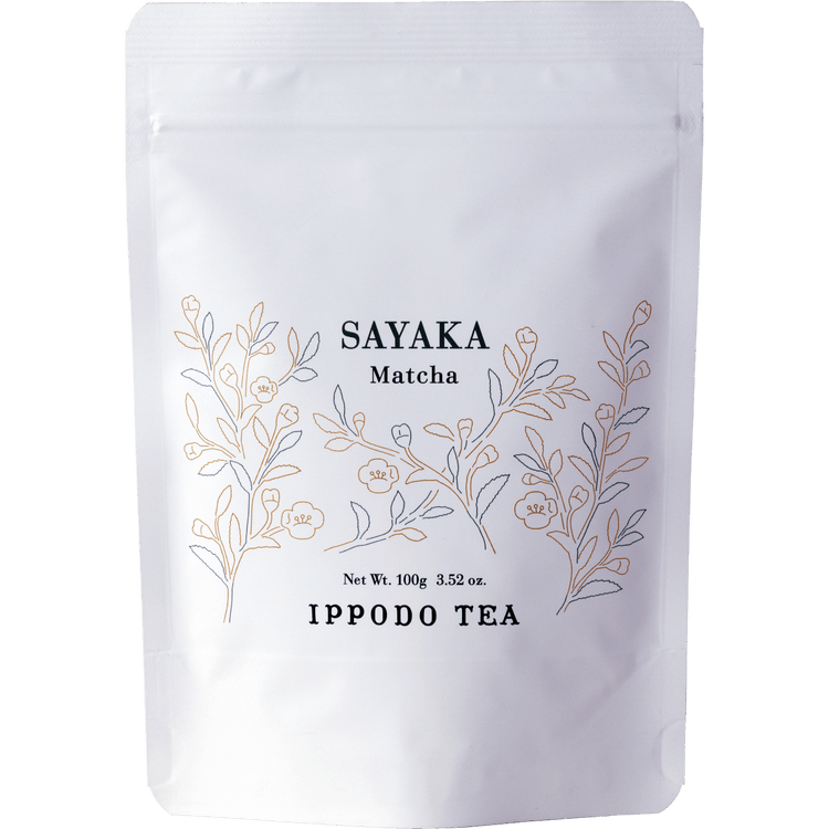 White resealable 100 gram bag of Ippodo Sayaka matcha with gold minimalist floral design
